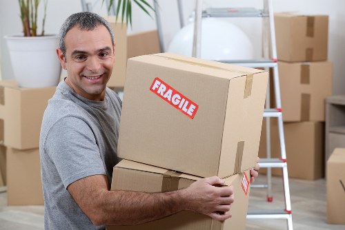 Moving team handling boxes for a Shepherdsbush home move