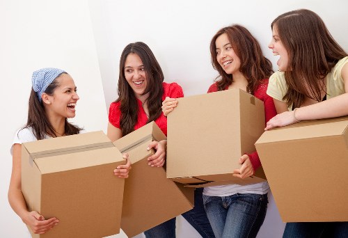 Packed moving boxes and labelled items ready for collection in Shepherdsbush